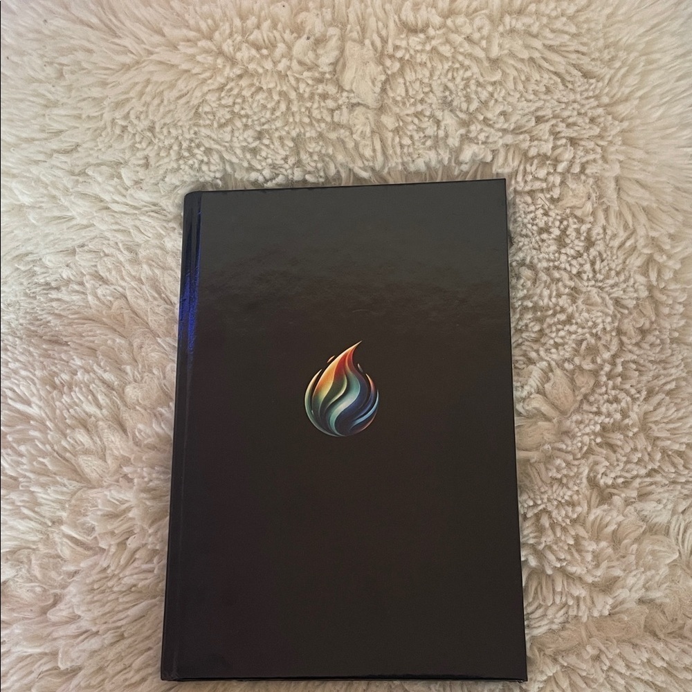 Black Notebook with Colorful Flame Design